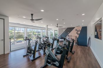 Private cycle room in the fitness center at abstract at design district in dallas tx, 75207